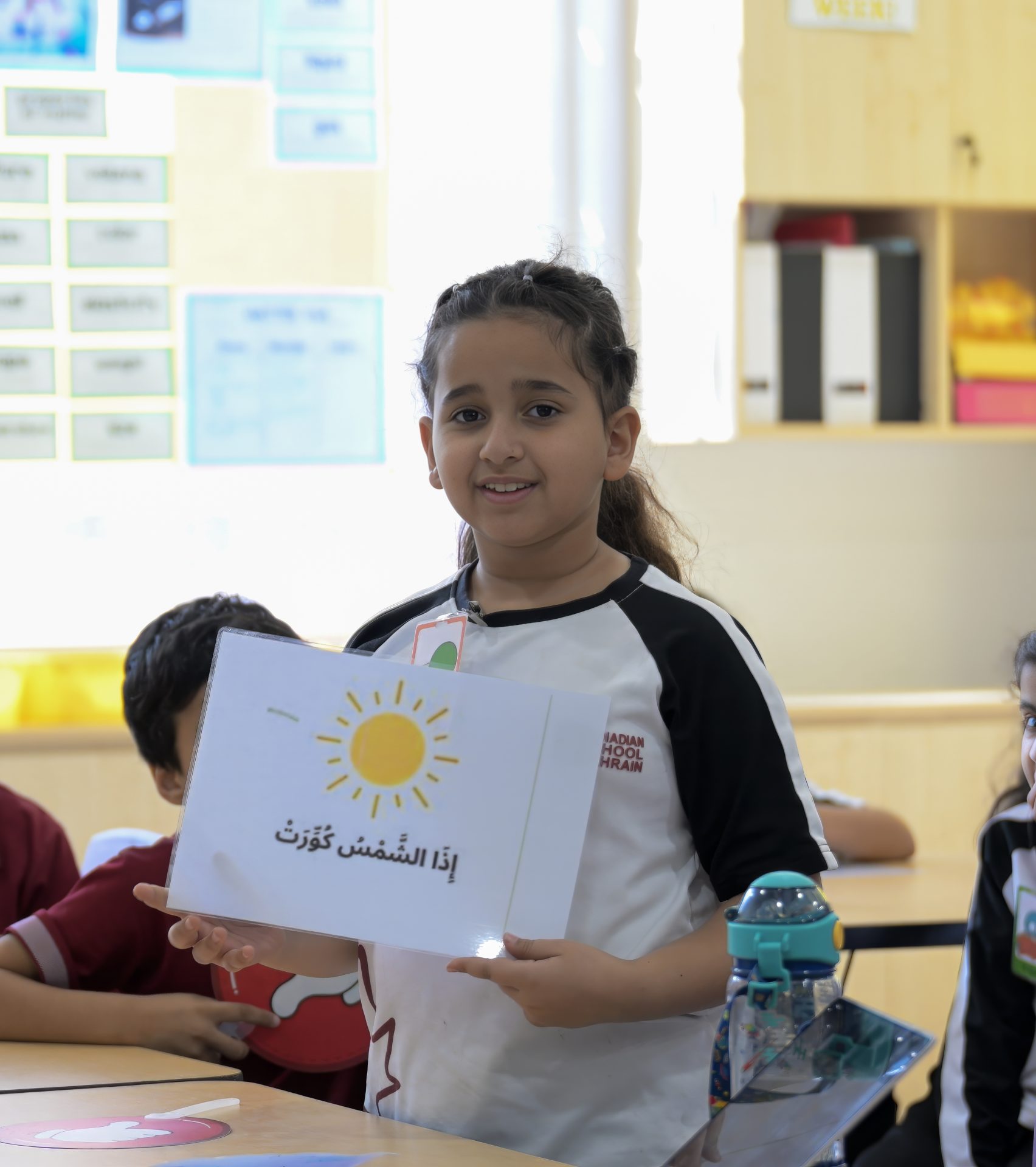 CSB Elementary students collaborating in a bright classroom